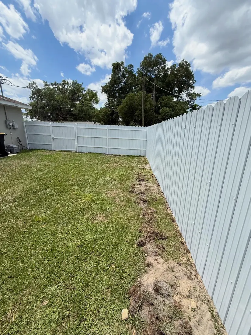 White vinyl privacy fence installation