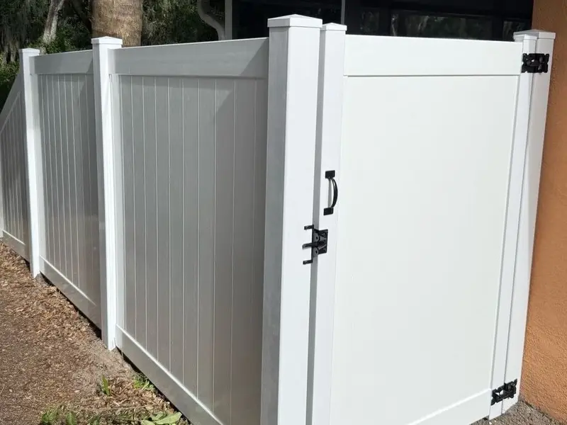 New vinyl fence gate installed on a Tampa property